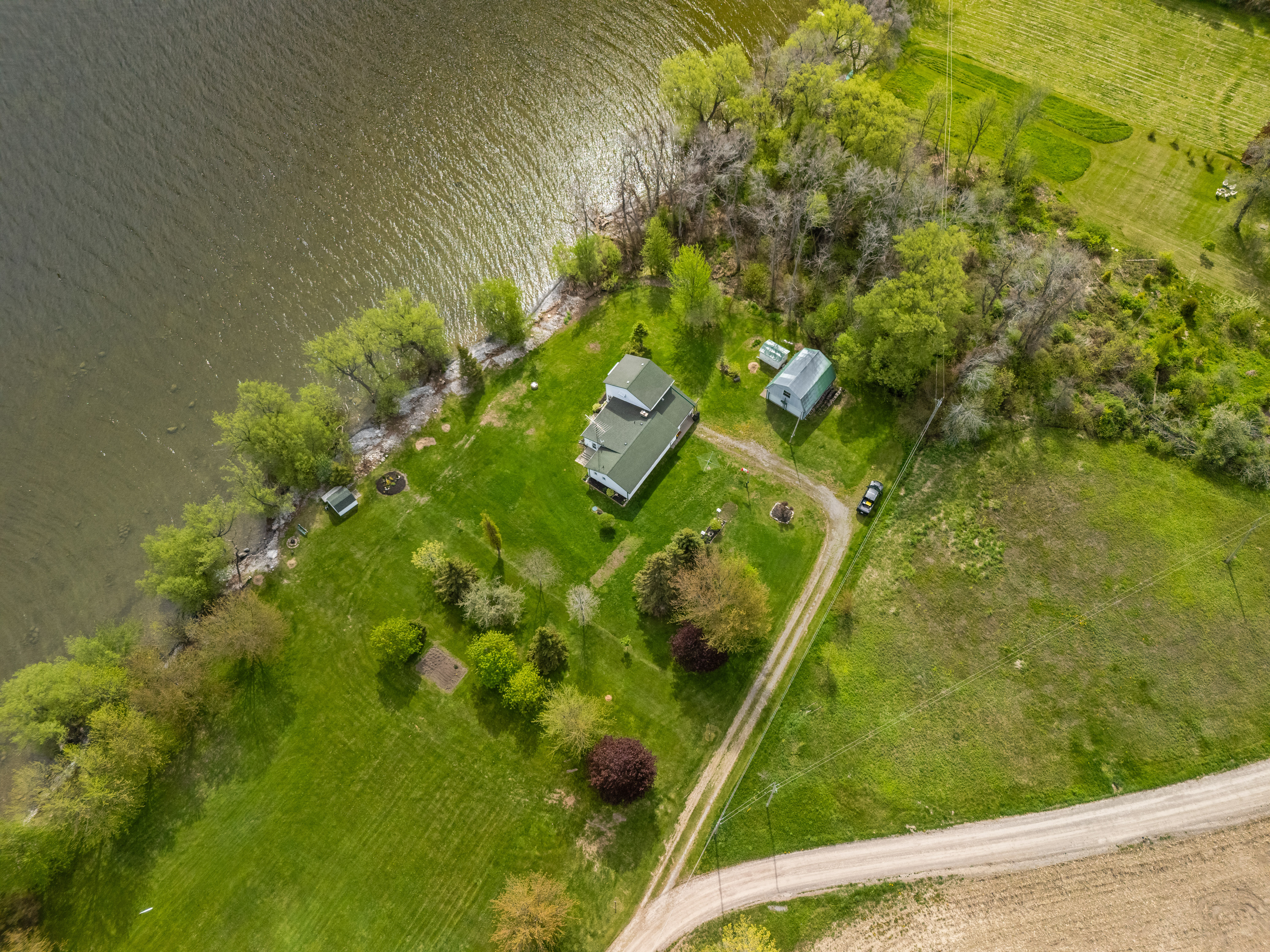 Overhead view of the home on its waterfront lot